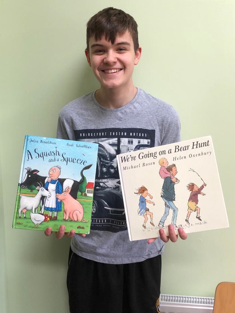 Boy holding books